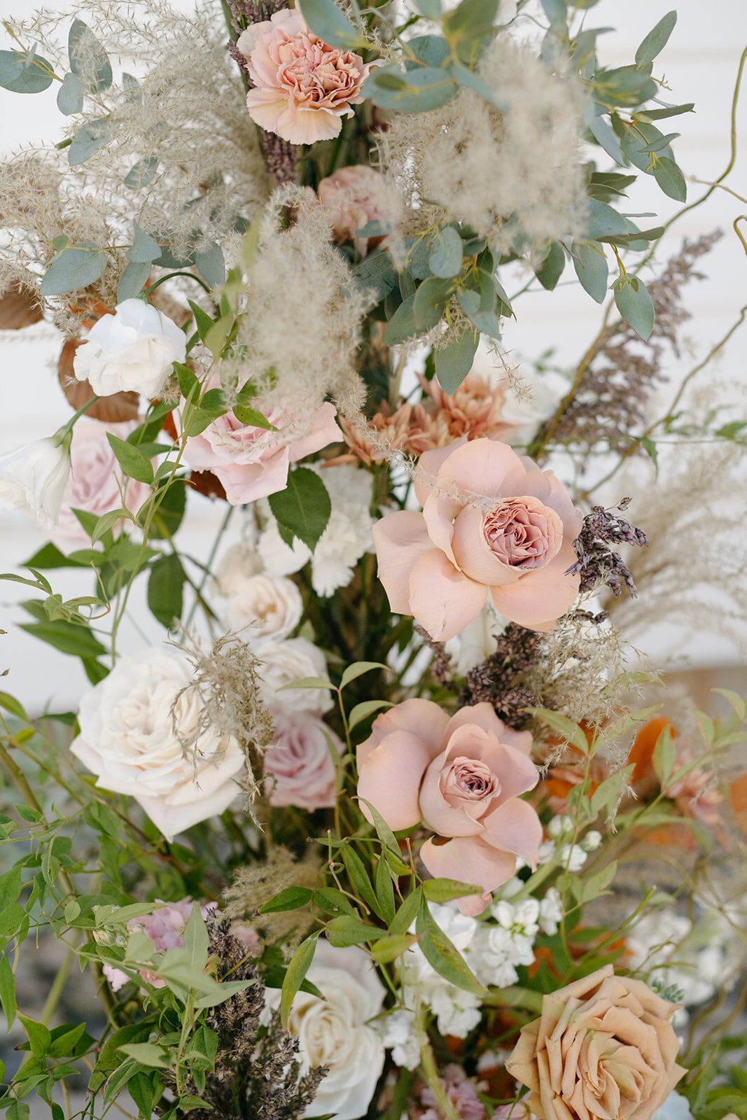 A close up of a bouquet of flowers on a table.