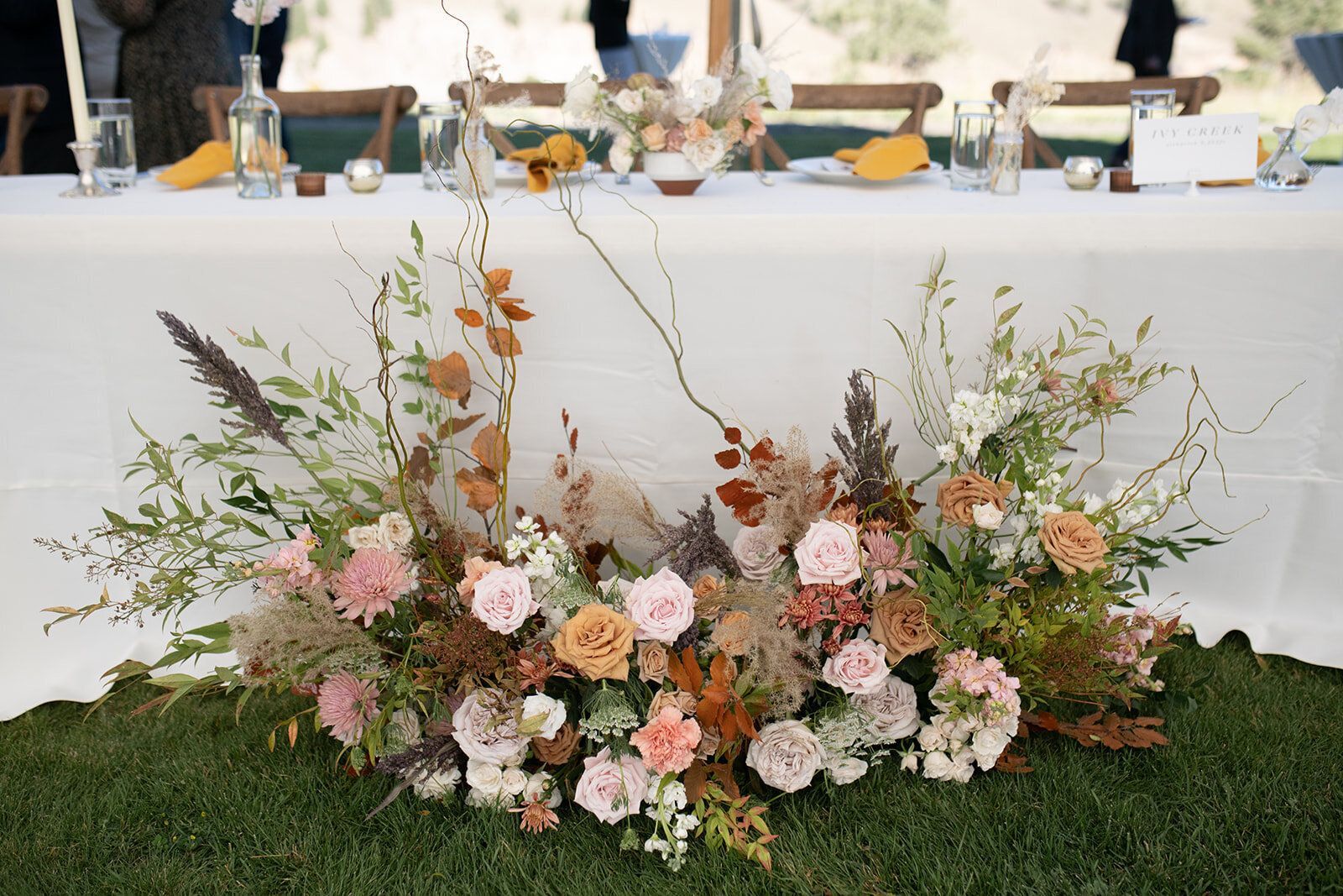 A table with a bunch of flowers on it