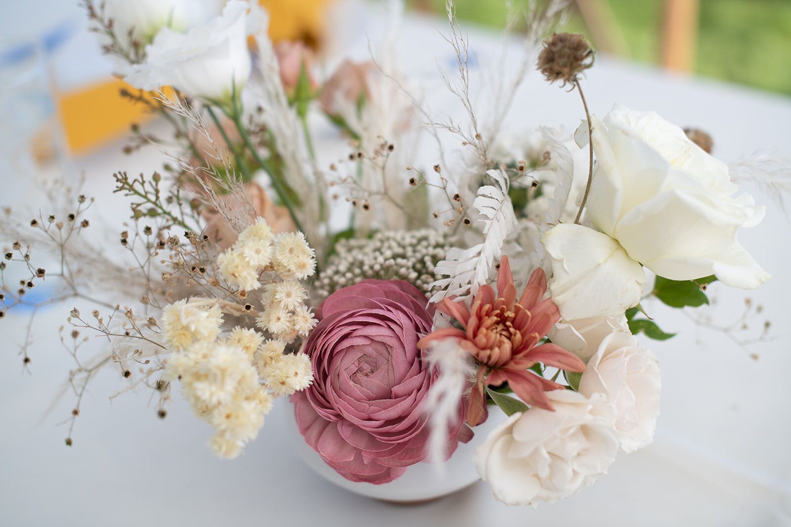 A vase filled with flowers is sitting on a table.