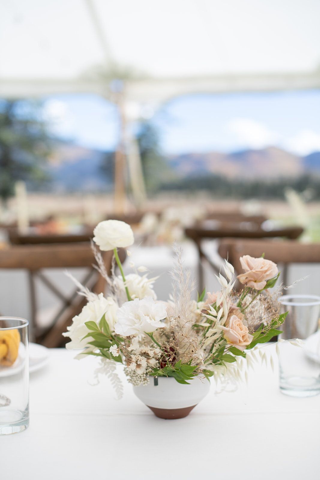 A vase filled with flowers is sitting on a table.