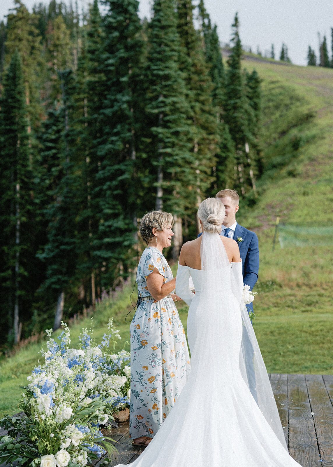 A bride and groom are standing next to each other at their wedding ceremony.