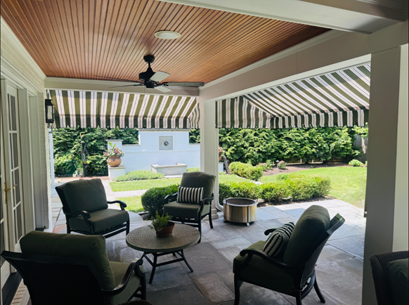 One family house, wooden terrace with awnings in the evening.