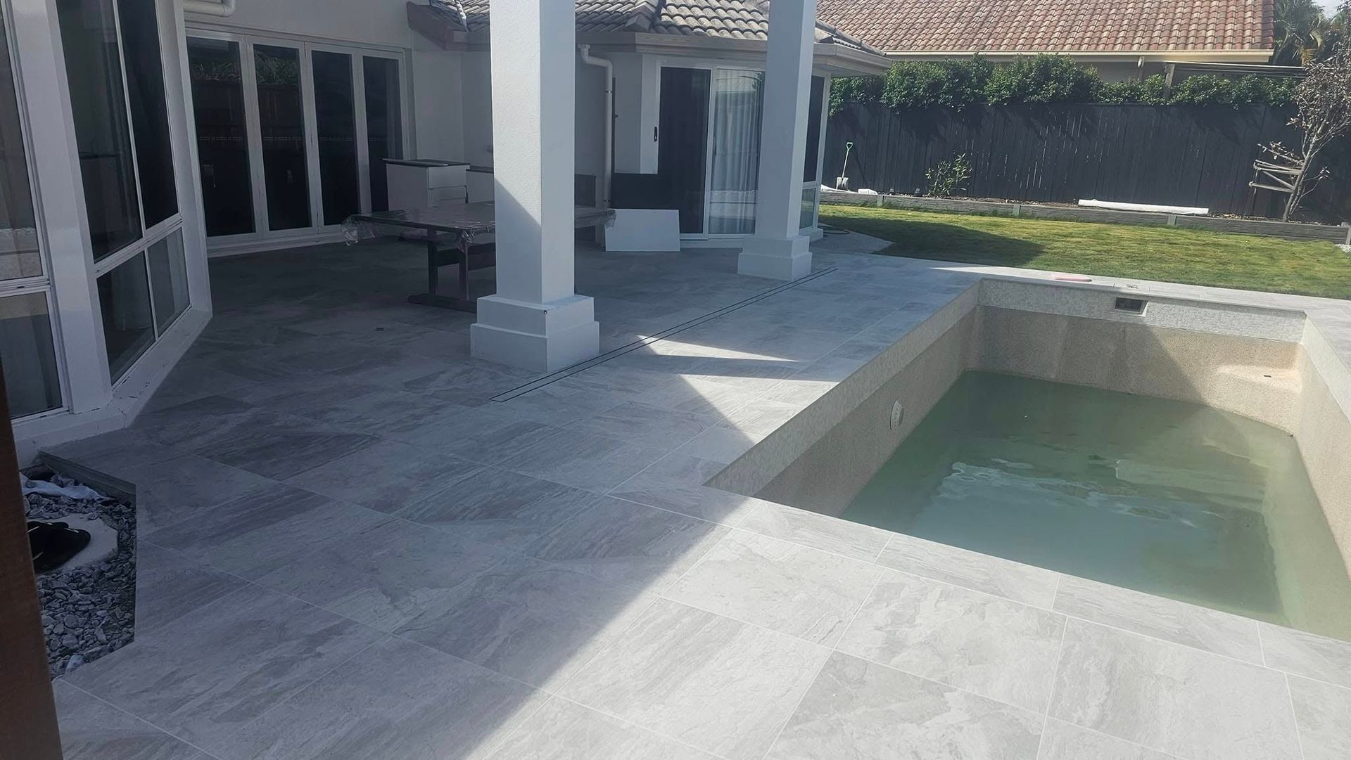  New tiles laid around a pool — Sunny Tiling Co in Mount Coolum, QLD