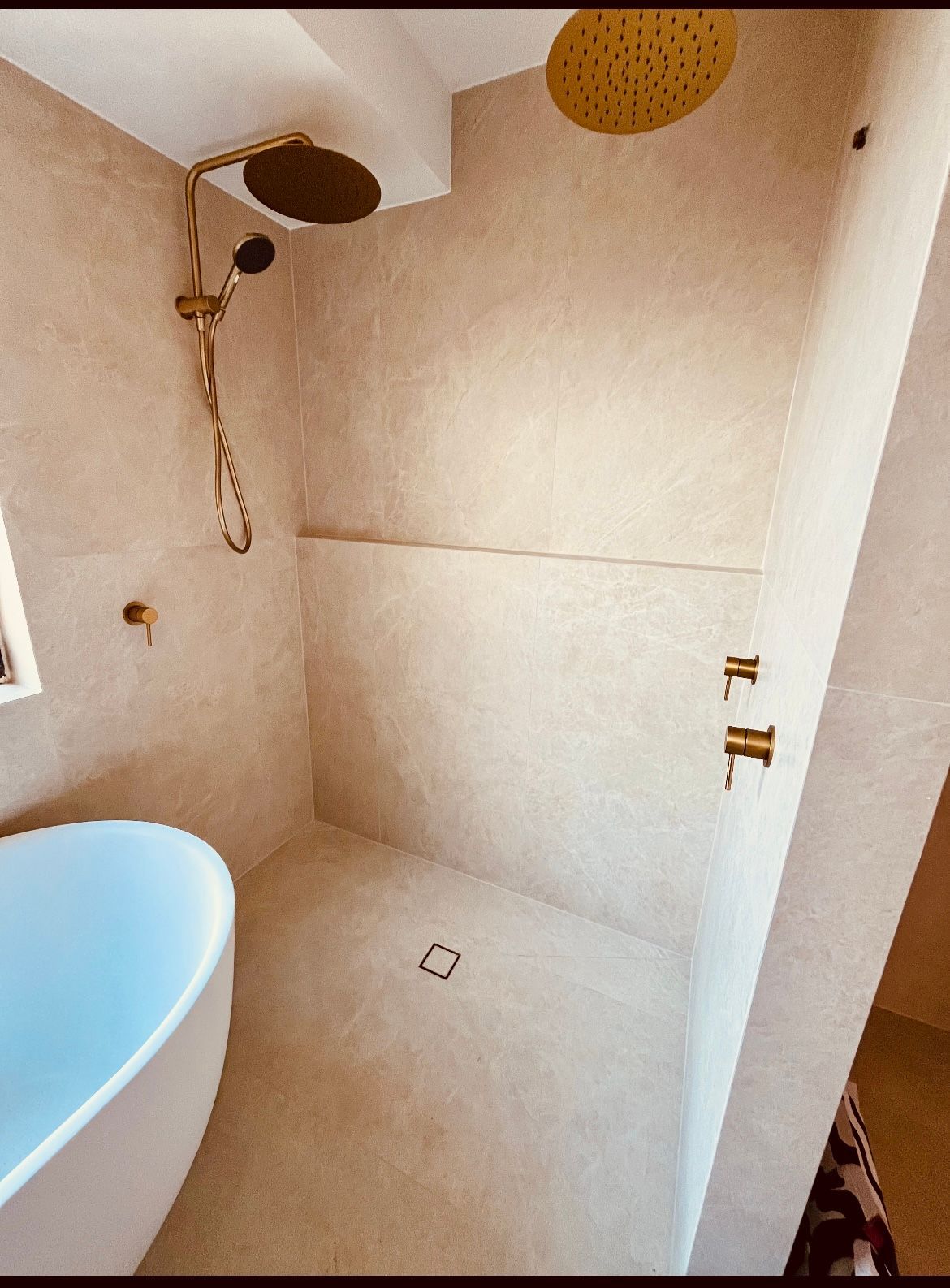 A Bathroom With a Sink and a Walk in Shower — Sunny Tiling Co in Mount Coolum, QLD