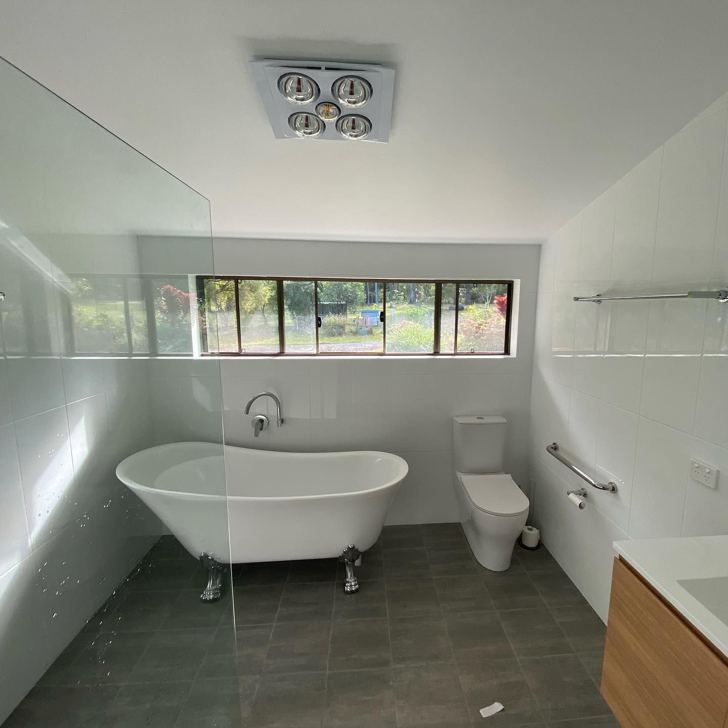 A Modern Bathroom with A Clawfoot Tub — Coastline Building & Renovations In Forster, NSW