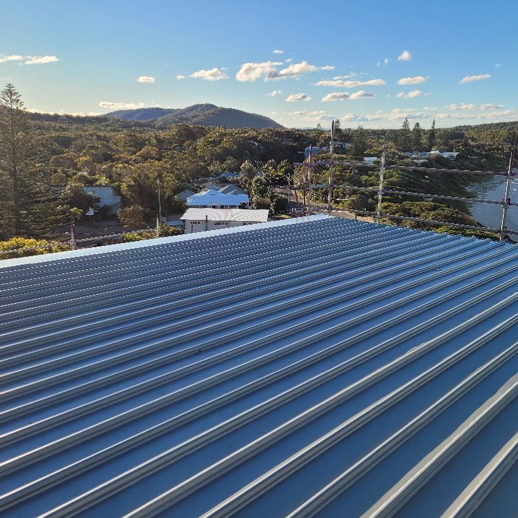 A Metal Roof with Trees — Coastline Building & Renovations In Forster, NSW