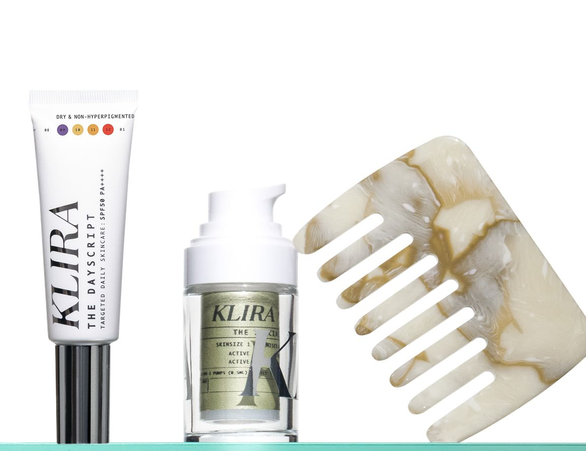 KLIRA skincare products and a marble comb on a white background.