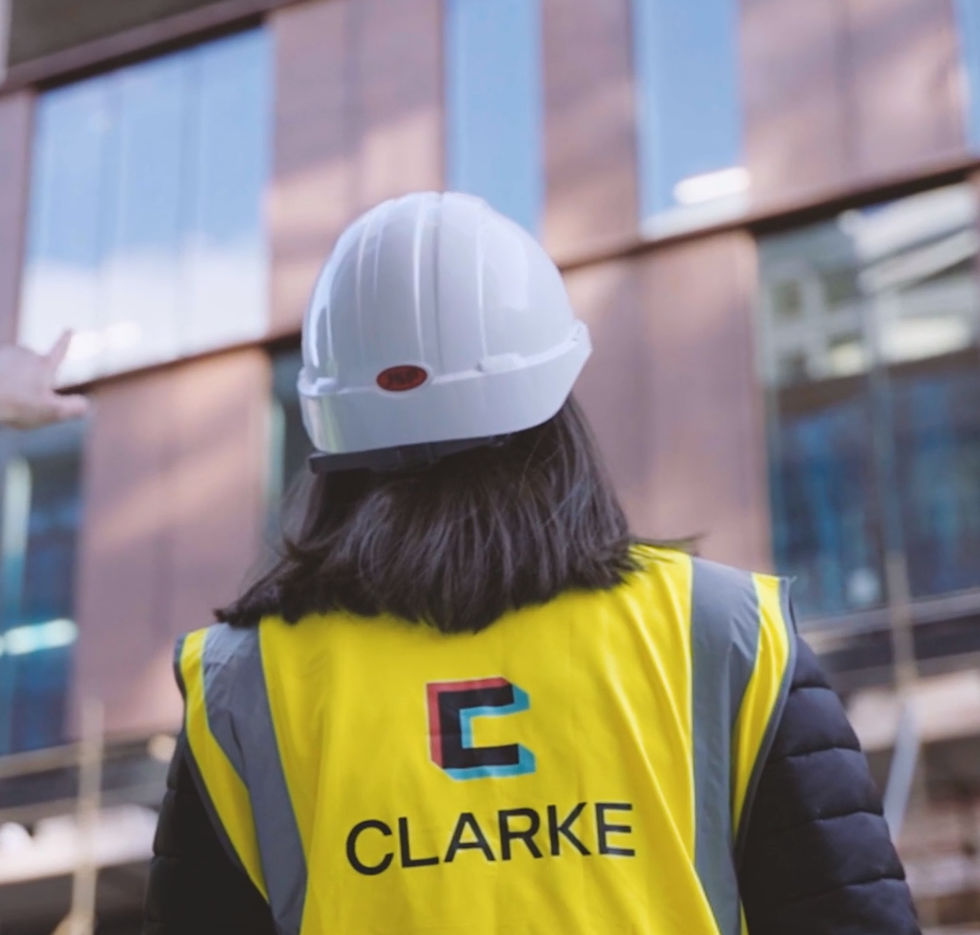 Woman in hard hat and safety vest, 