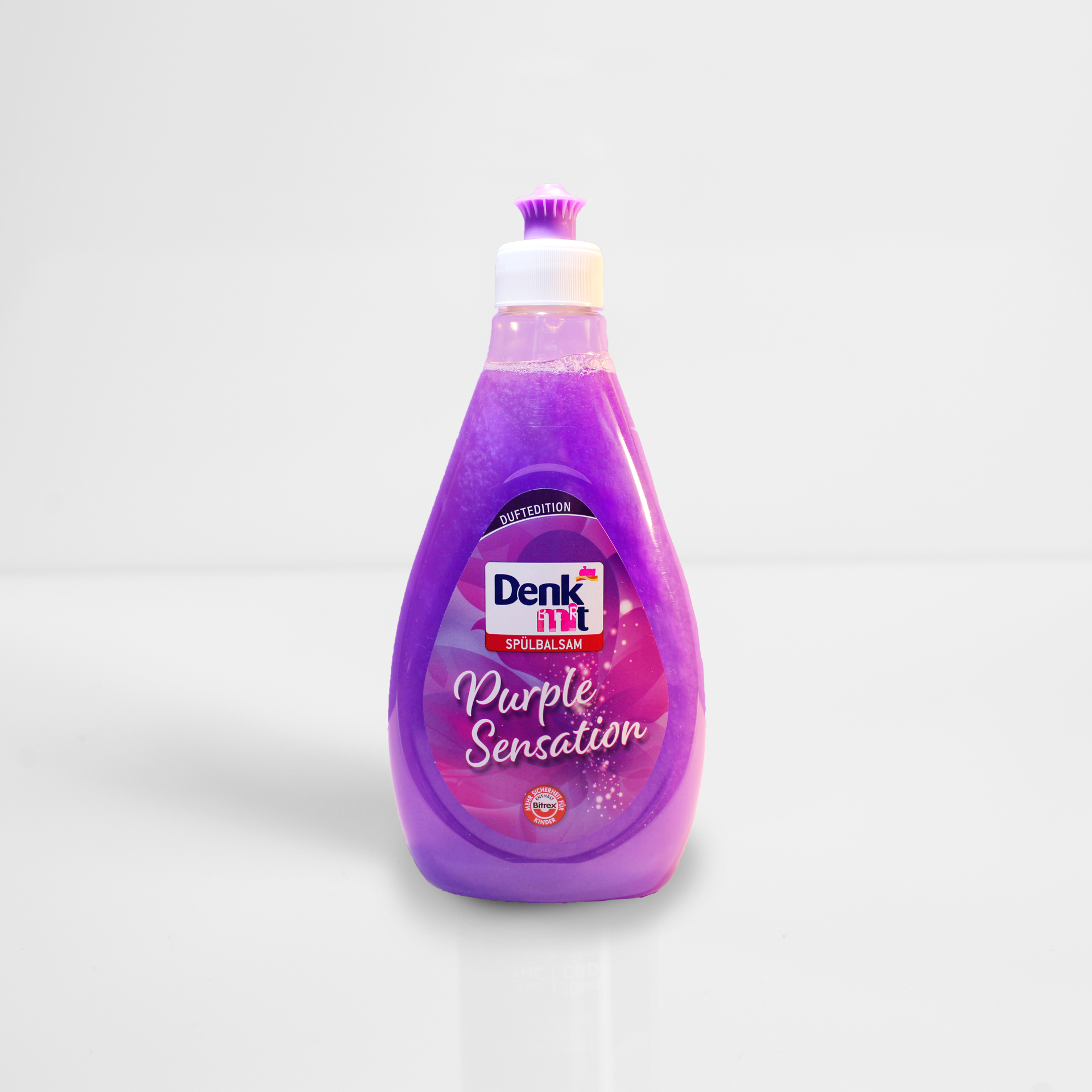 Purple Denkmit “Purple Sensation” cleaning product bottle on a white background