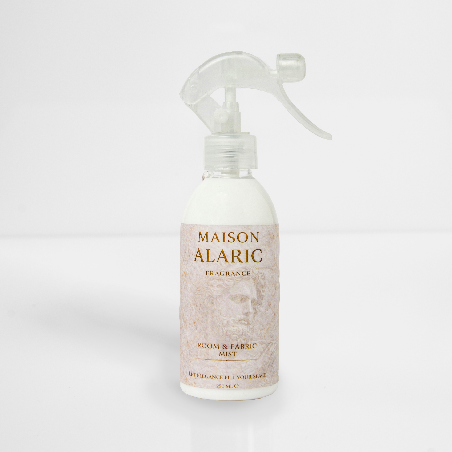 White Maison Alaric body mist spray bottle with clear trigger on a light background