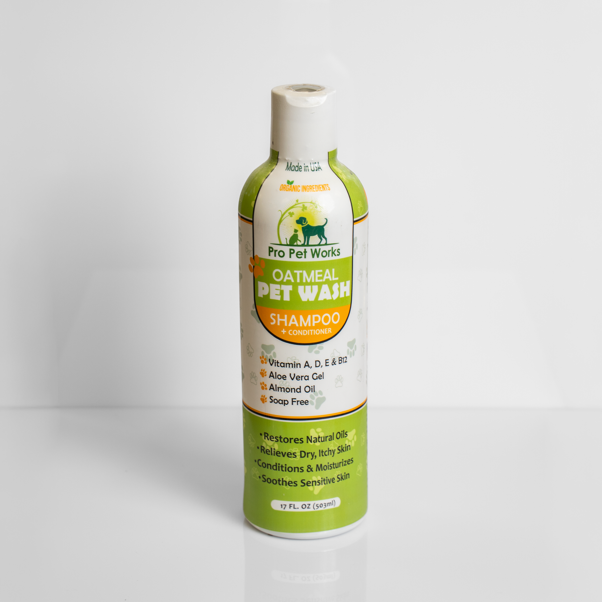 Green bottle of oatmeal pet wash shampoo with white label on a plain background
