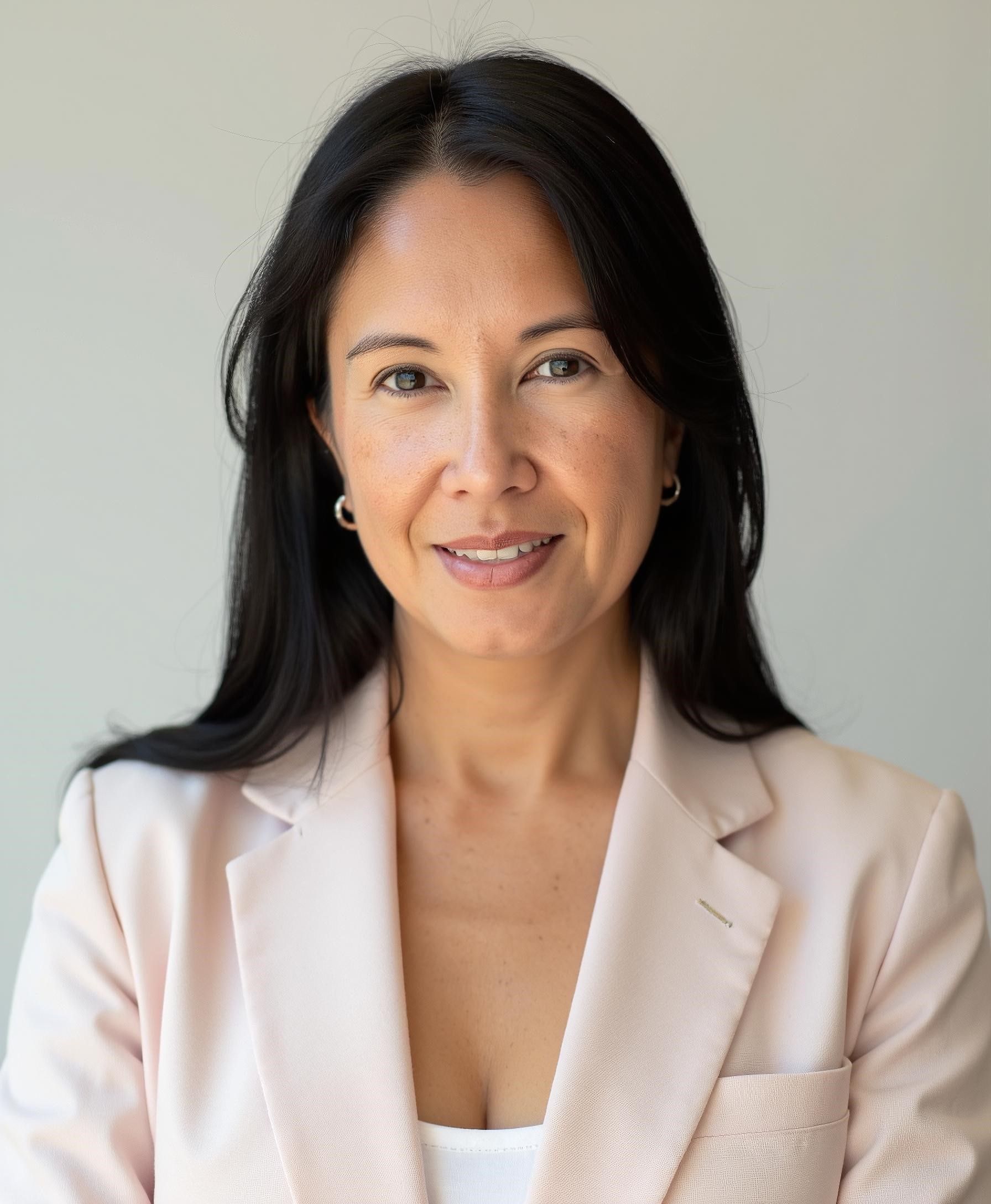 A woman with gray hair and a leopard print shirt is smiling for the camera.