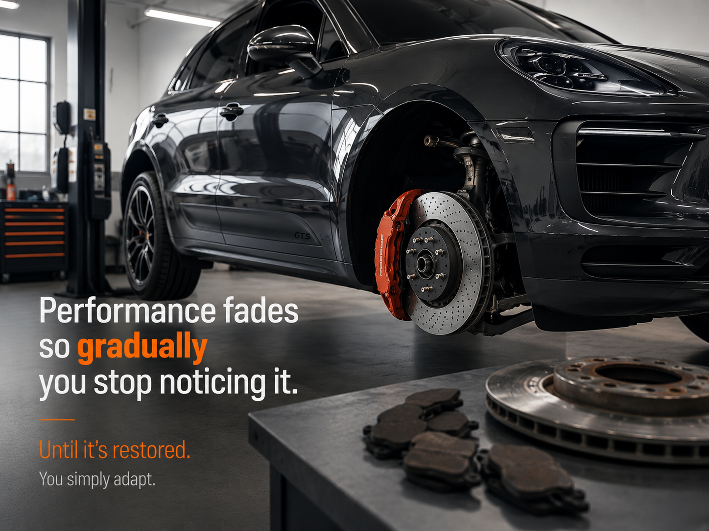 Black car on a garage lift with exposed brake rotor and pads, with text about performance fading and restoring.