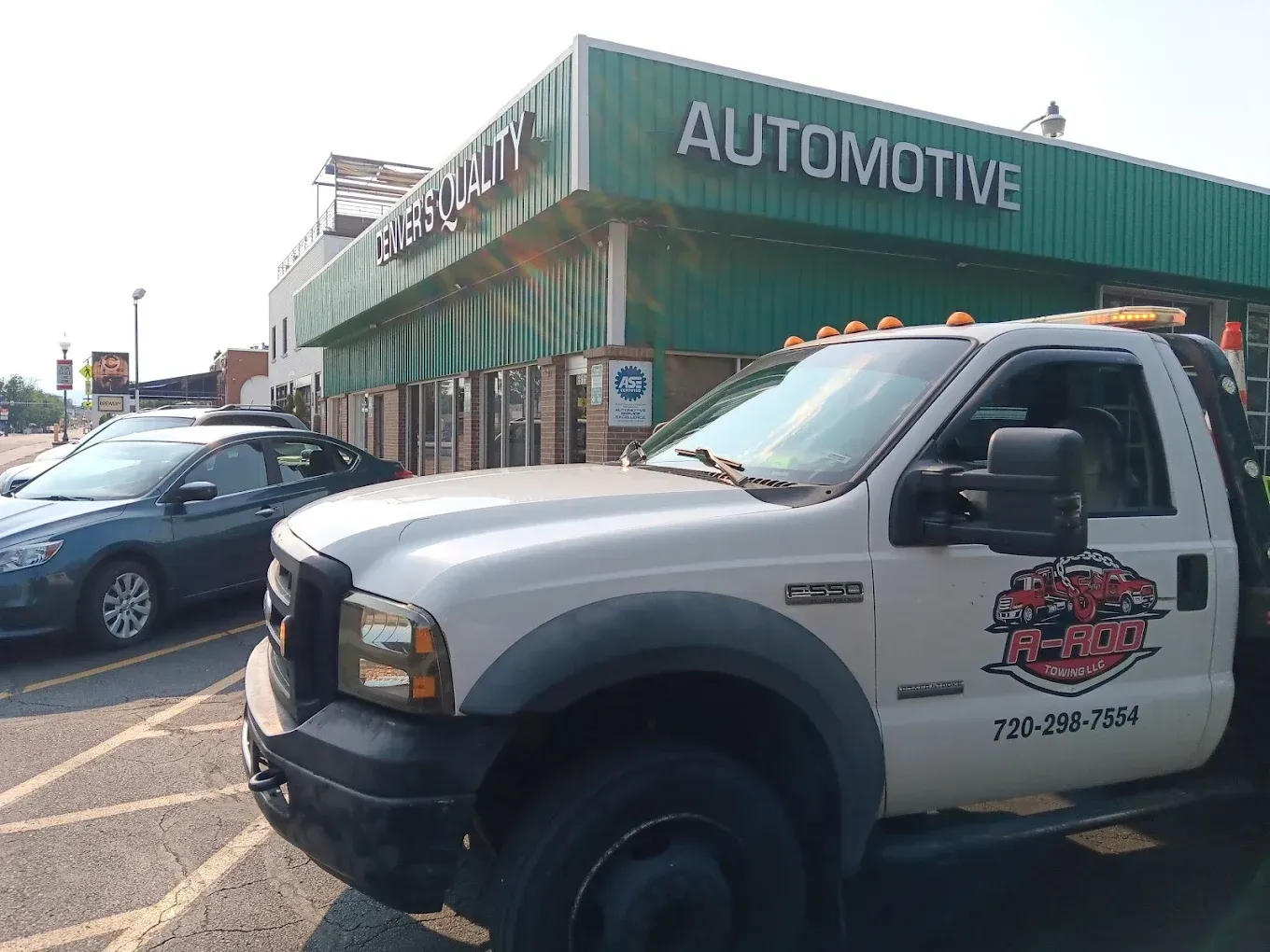 Tow Truck Parked in Front of Auto Shop | Denver's Quality Automotive