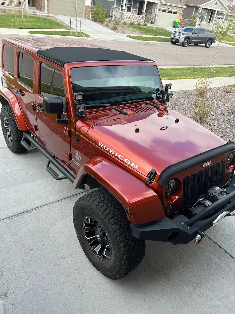 Red Jeep Parked Outside | Denver's Quality Automotive