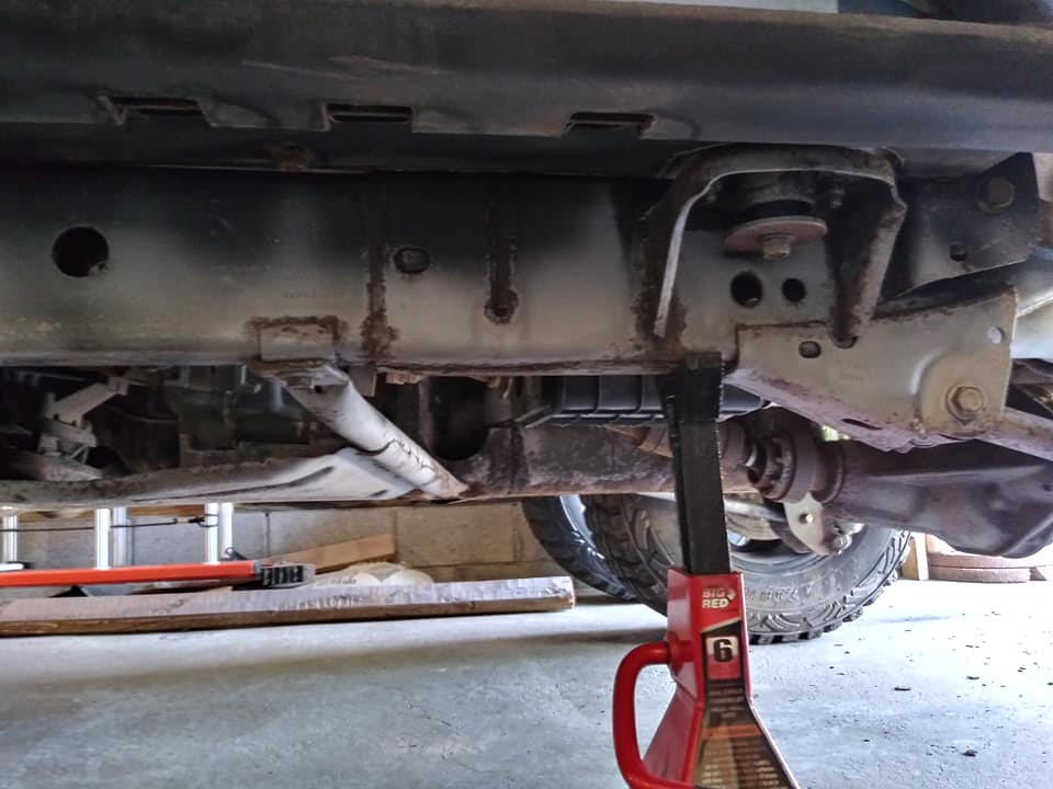 Big Red Steel Jack Stands Lifting the Vehicle — Indiana, PA — Keystone Dustless Mobile Media Blasting LLC