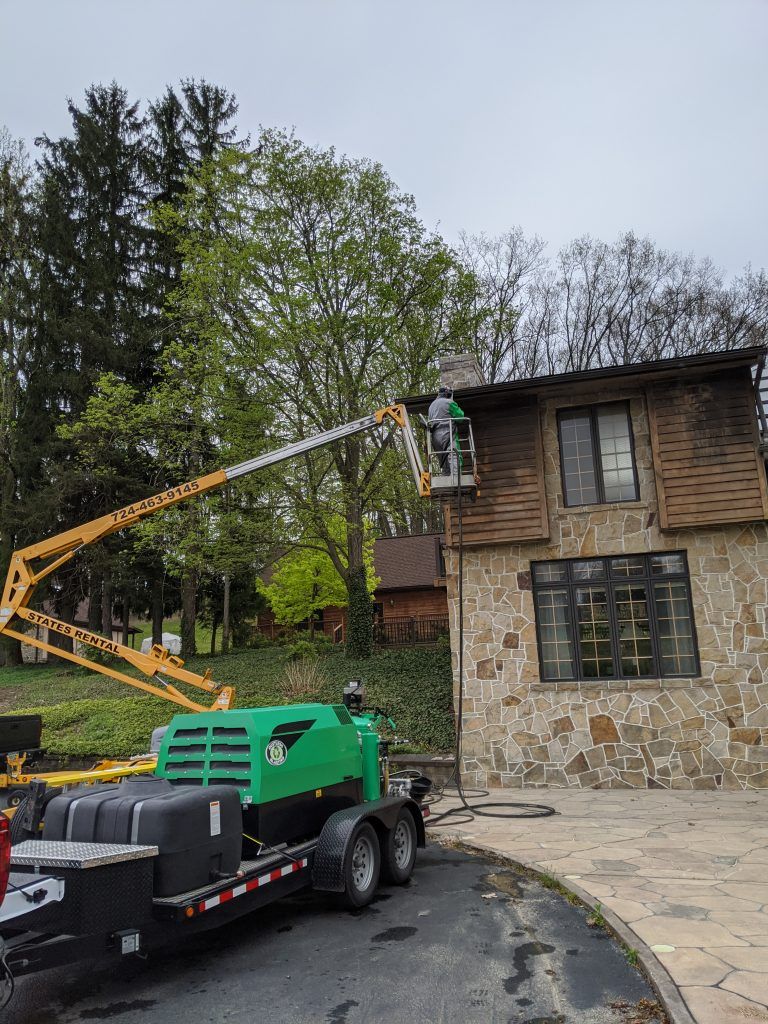 Staff Cleaning the Visible Stain of the House — Indiana, PA — Keystone Dustless Mobile Media Blasting LLC