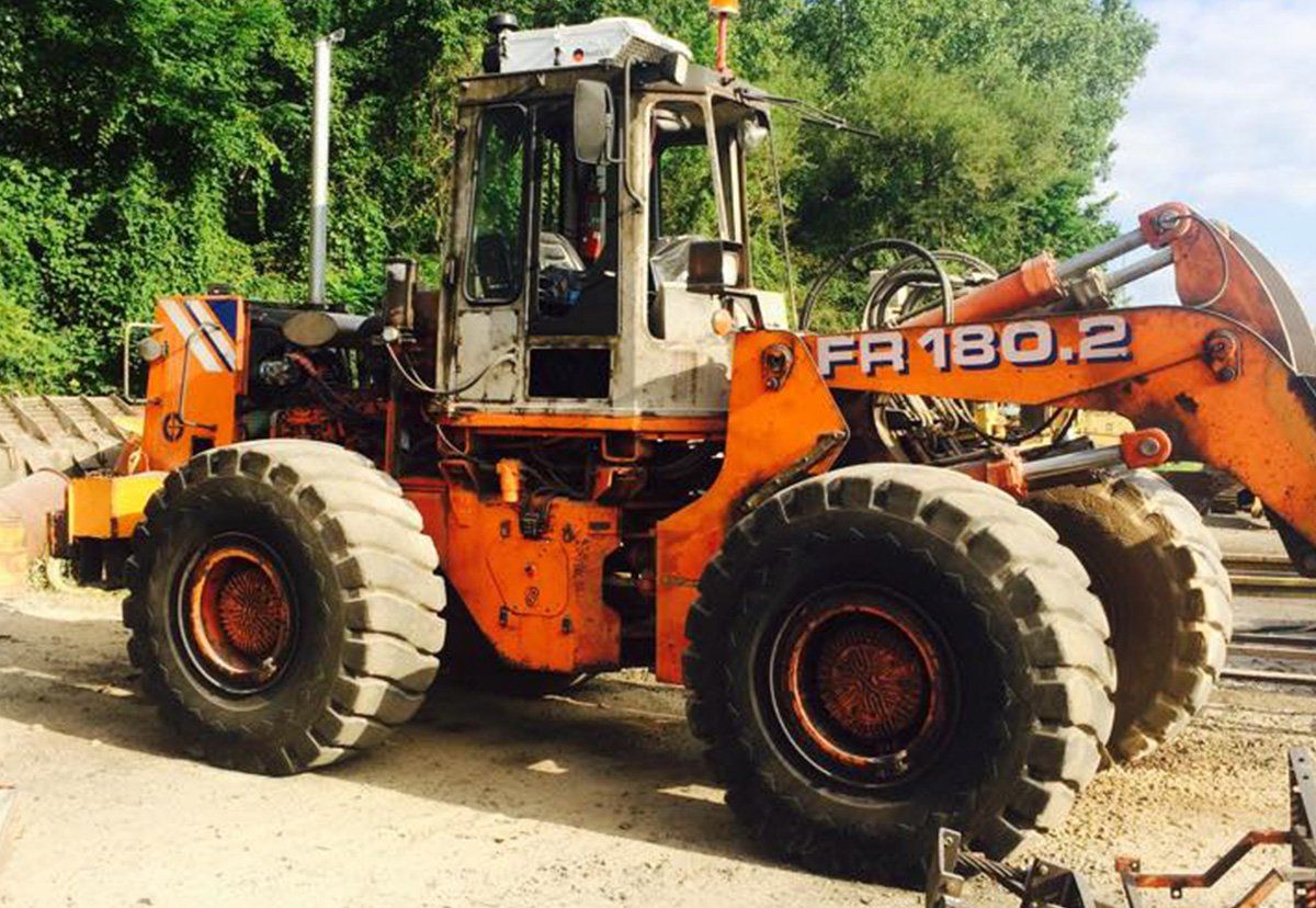 Orange Wheel Loader — Indiana, PA — Keystone Dustless Mobile Media Blasting LLC