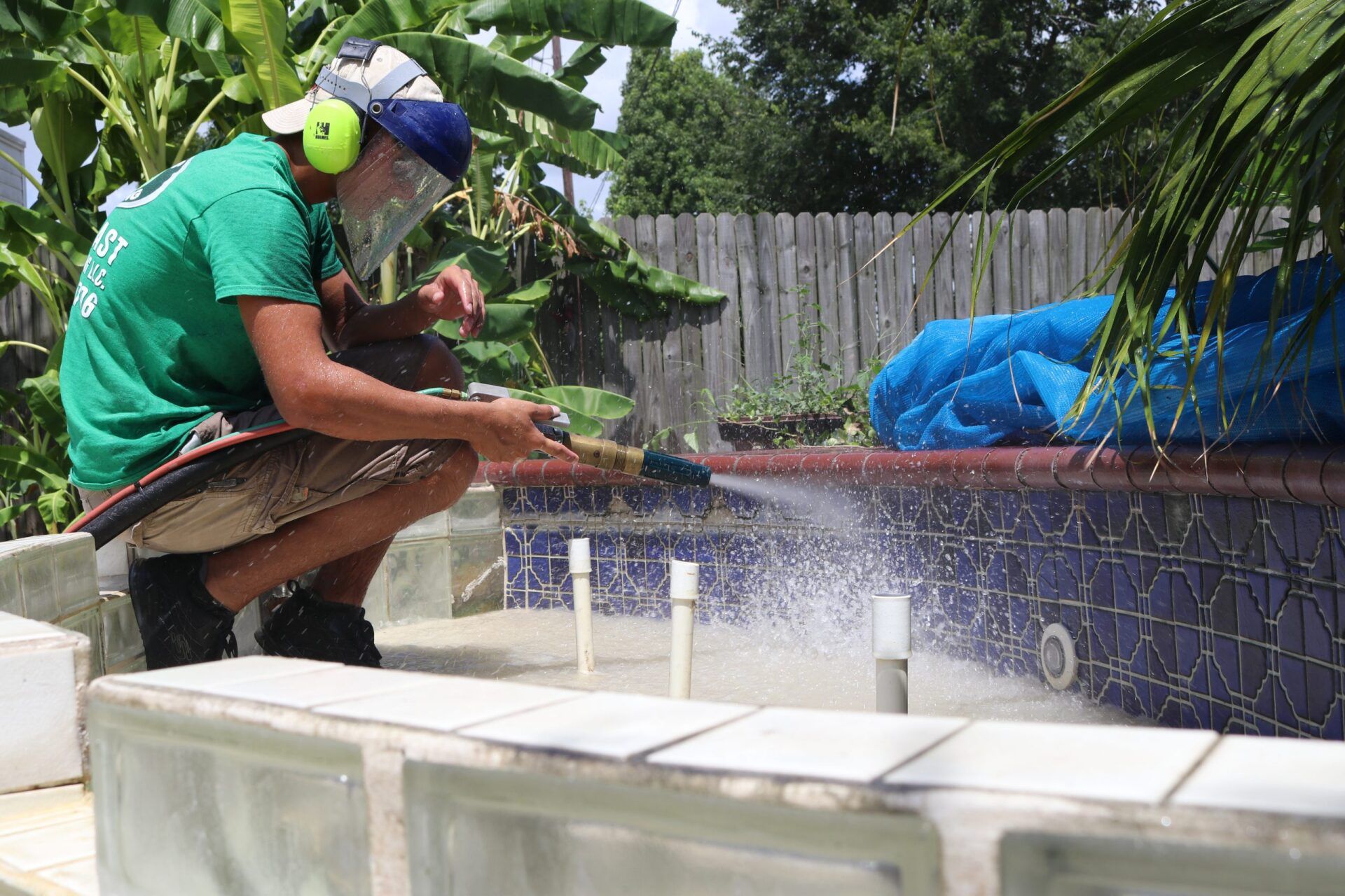 Man Cleaning Patio with Stone Tiles — Indiana, PA — Keystone Dustless Mobile Media Blasting LLC