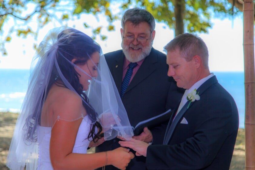 Bride and Groom Exchanging Ring — Wedding Services in Mount Pleasant, QLD