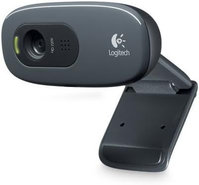 Logitech C270 webcam, dark gray with black mount, angled, showing lens and logo.