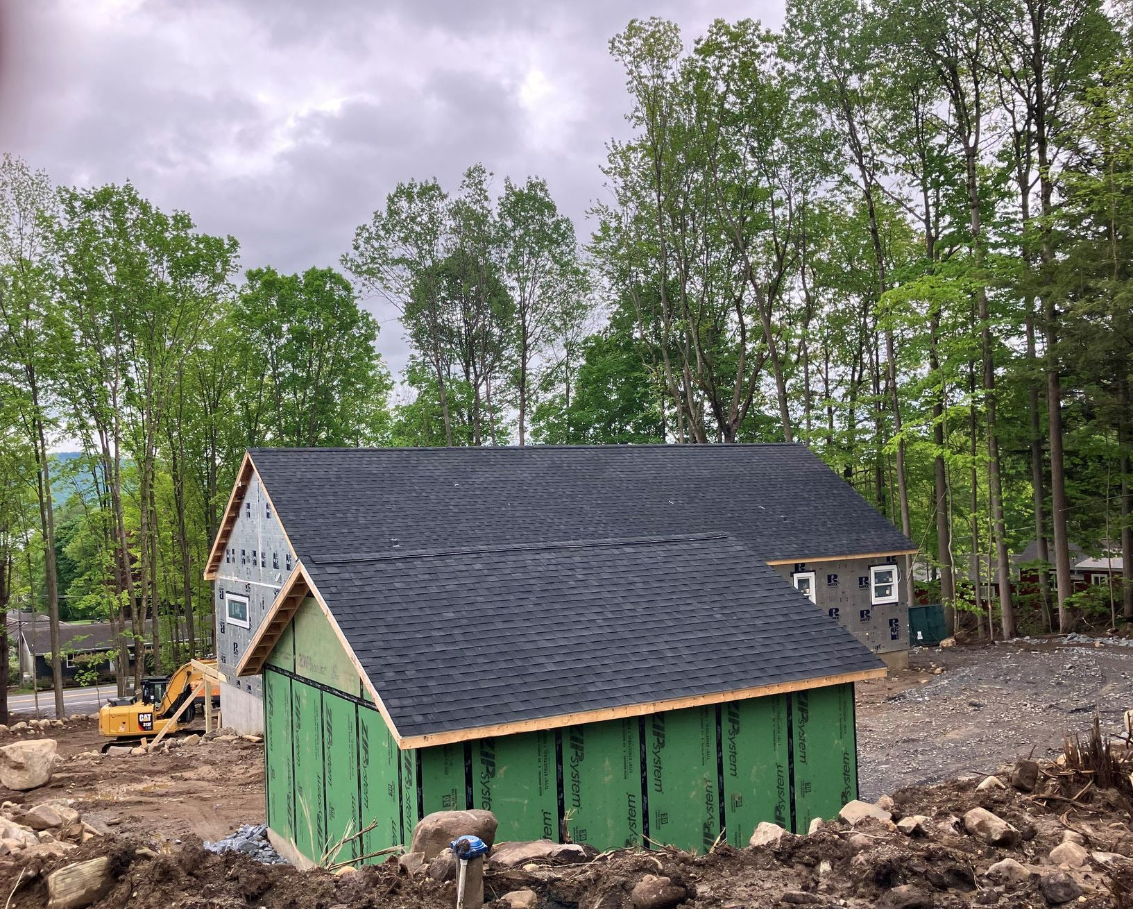 A house is being built in the middle of a forest.