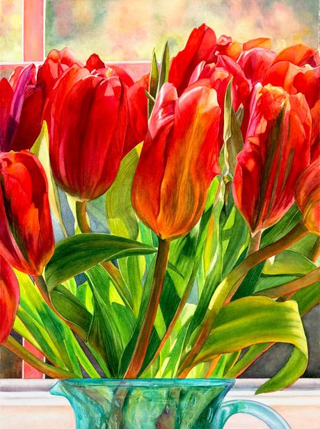 Large red tulips in front of window