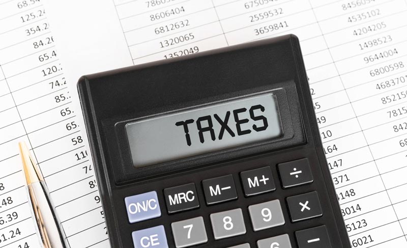 Taxes Written on a Calculator — Austin, TX — Hickson Law PC