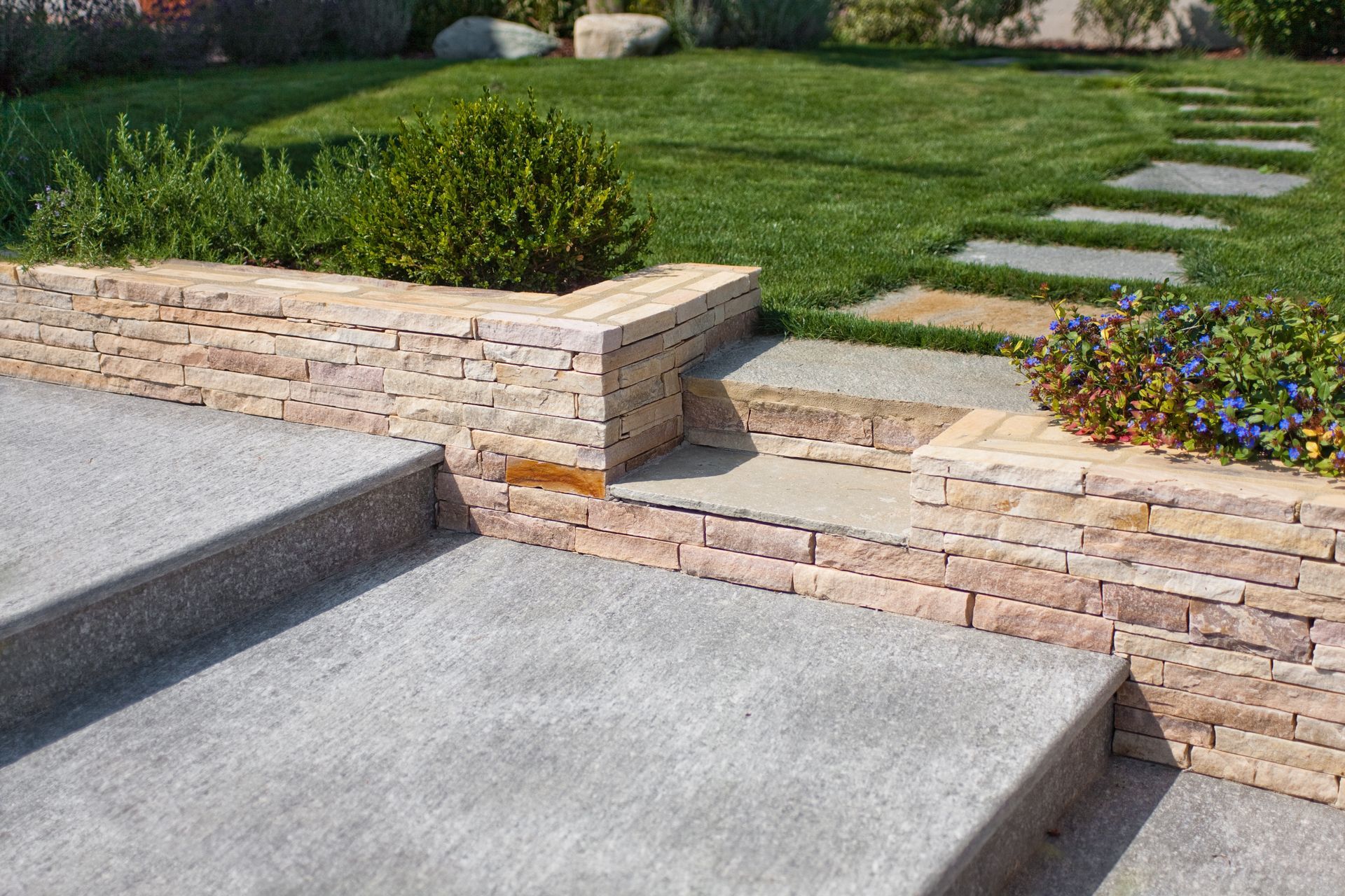 Stone steps leading up to a picturesque garden in a lovely home.