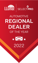 A red banner that says automotive regional dealer of the year 2022