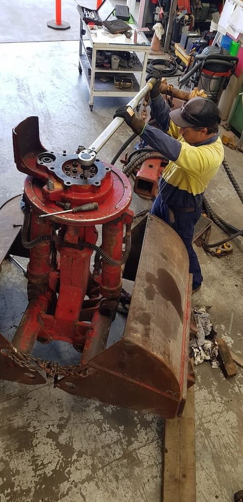 A Man Working on a Machine in a Garage — Hardarc Engineering in Coolum Beach, QLD