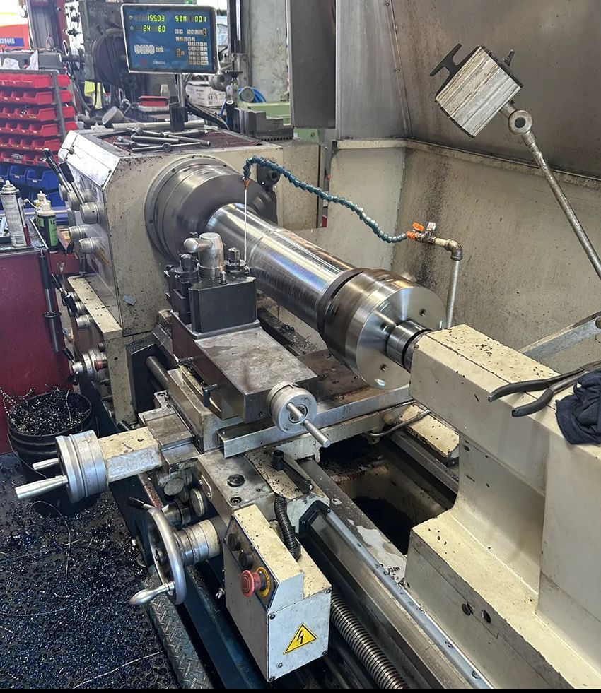 A Lathe is Being Used to Make a Piece of Metal — Hardarc Engineering in Coolum Beach, QLD