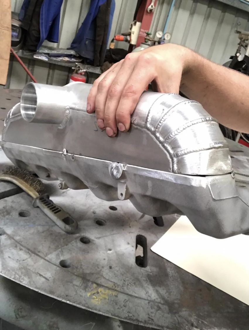 A Person is Holding a Piece of Metal on a Table — Hardarc Engineering in Coolum Beach, QLD