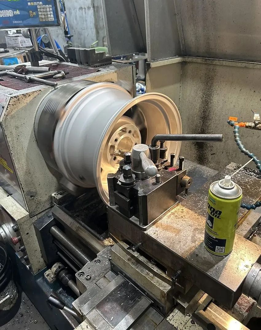 A Machine is Cutting a Wheel on a Lathe in a Factory — Hardarc Engineering in Coolum Beach, QLD