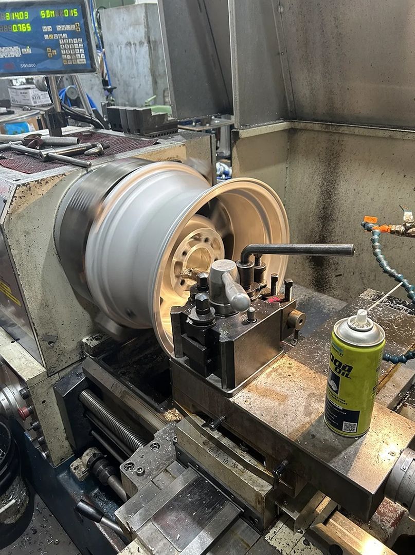 A Machine is Cutting a Wheel on a Lathe in a Factory — Hardarc Engineering in Coolum Beach, QLD