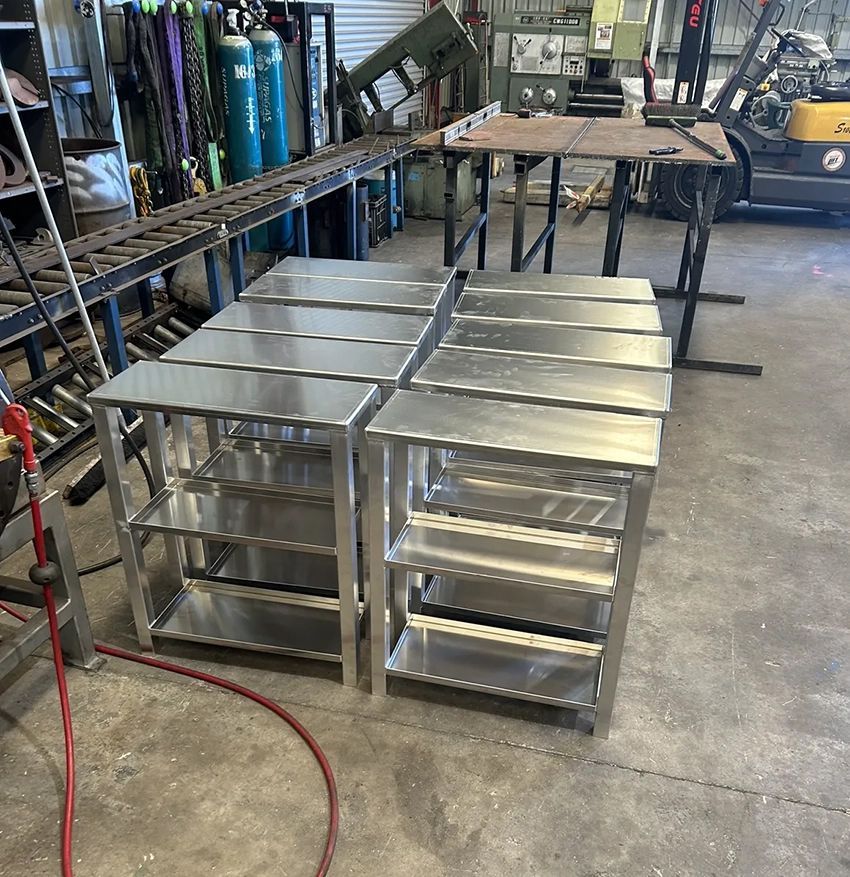 A Bunch of Stainless Steel Shelves Are Sitting in a Room — Hardarc Engineering in Coolum Beach, QLD