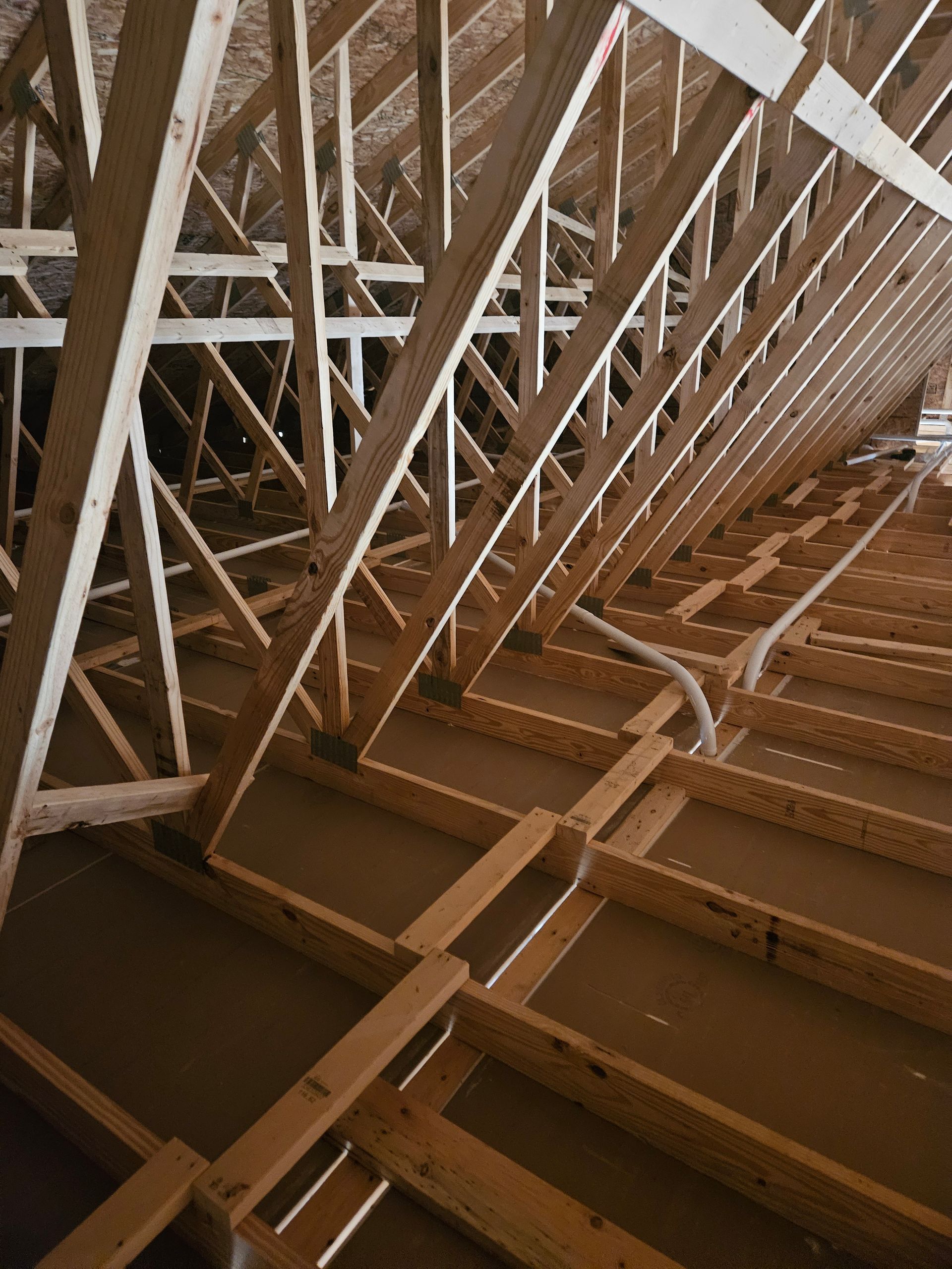 A building under construction with a lot of wooden beams