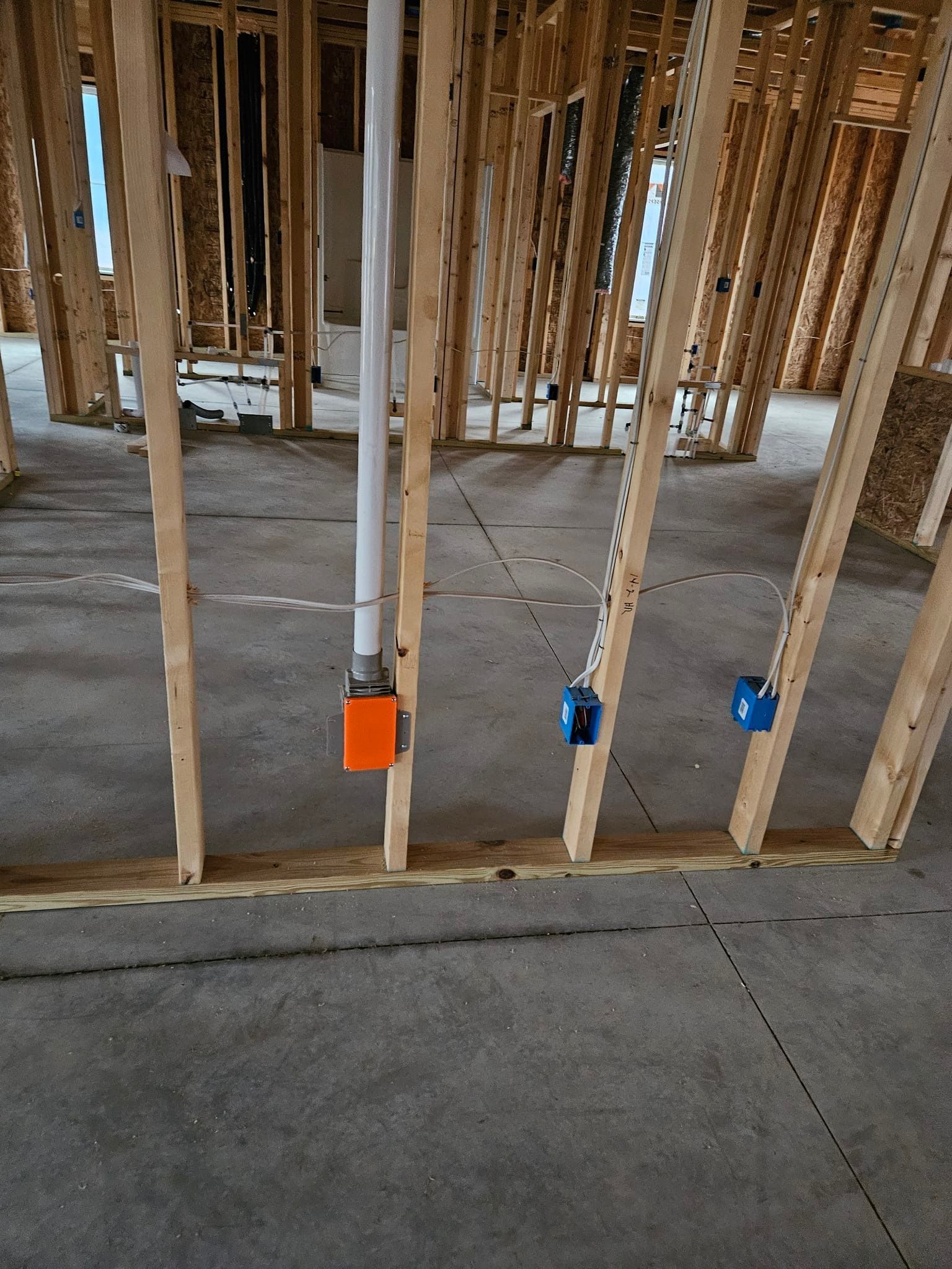 A house is being built with a lot of wooden beams.