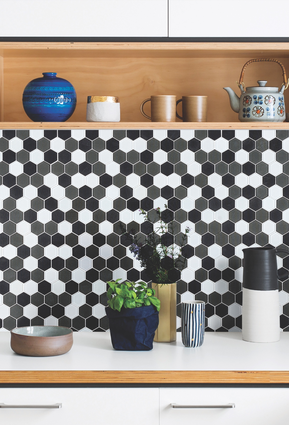 A Kitchen Counter With White Hexagon Tile Backsplash — Mid Coast Tiles Urunga In Urunga, NSW