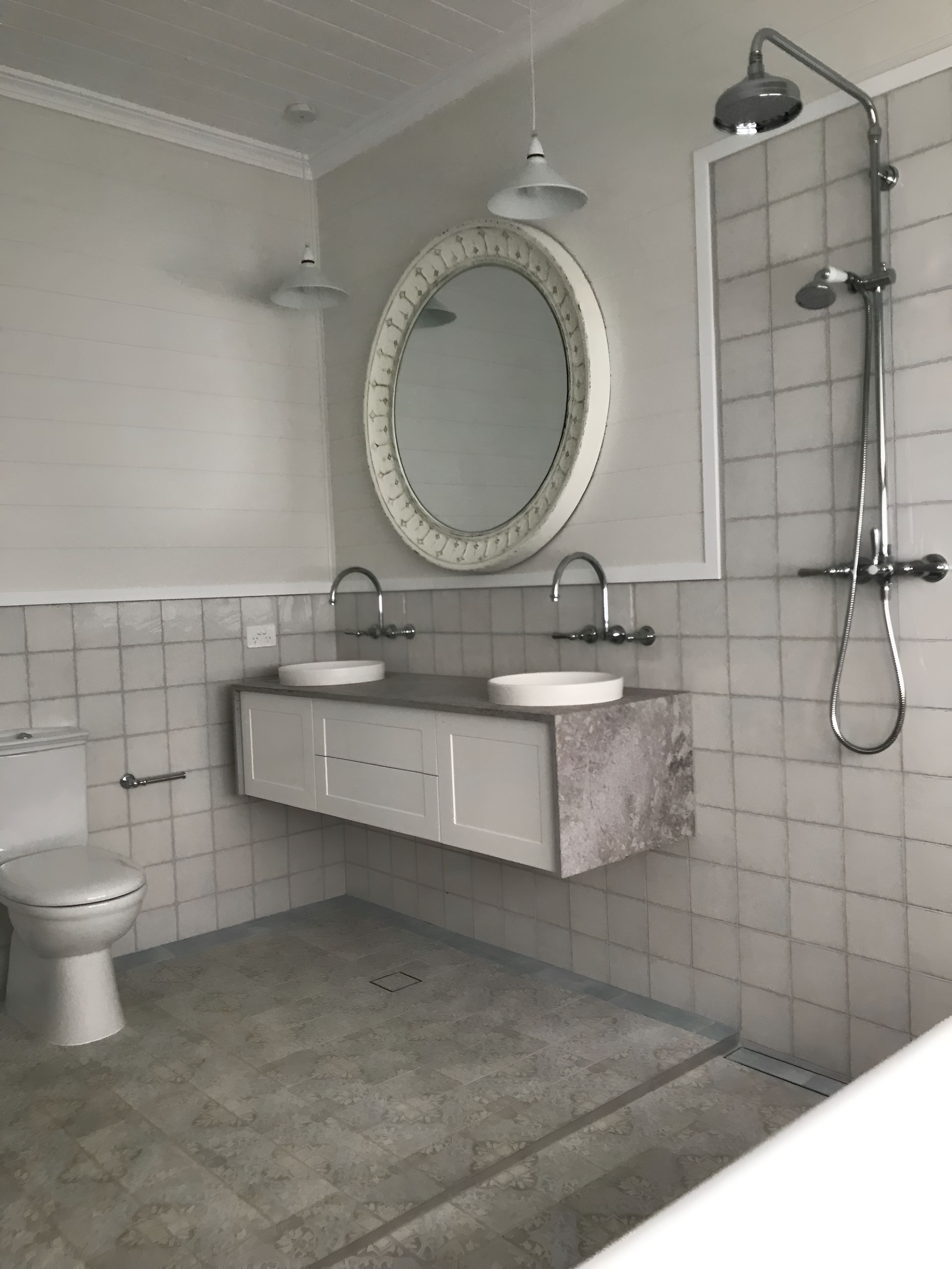 A Bathroom With Two Sinks And A Toilet — Mid Coast Tiles Urunga In Urunga, NSW