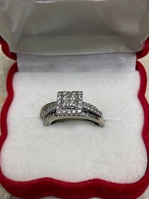 A diamond ring is sitting in a red box.
