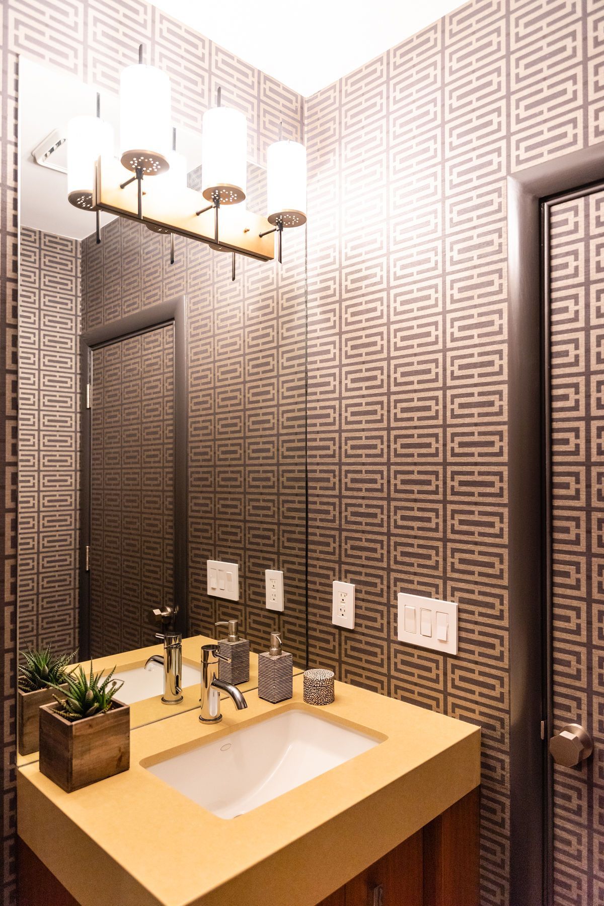 A bathroom with a sink and a mirror.