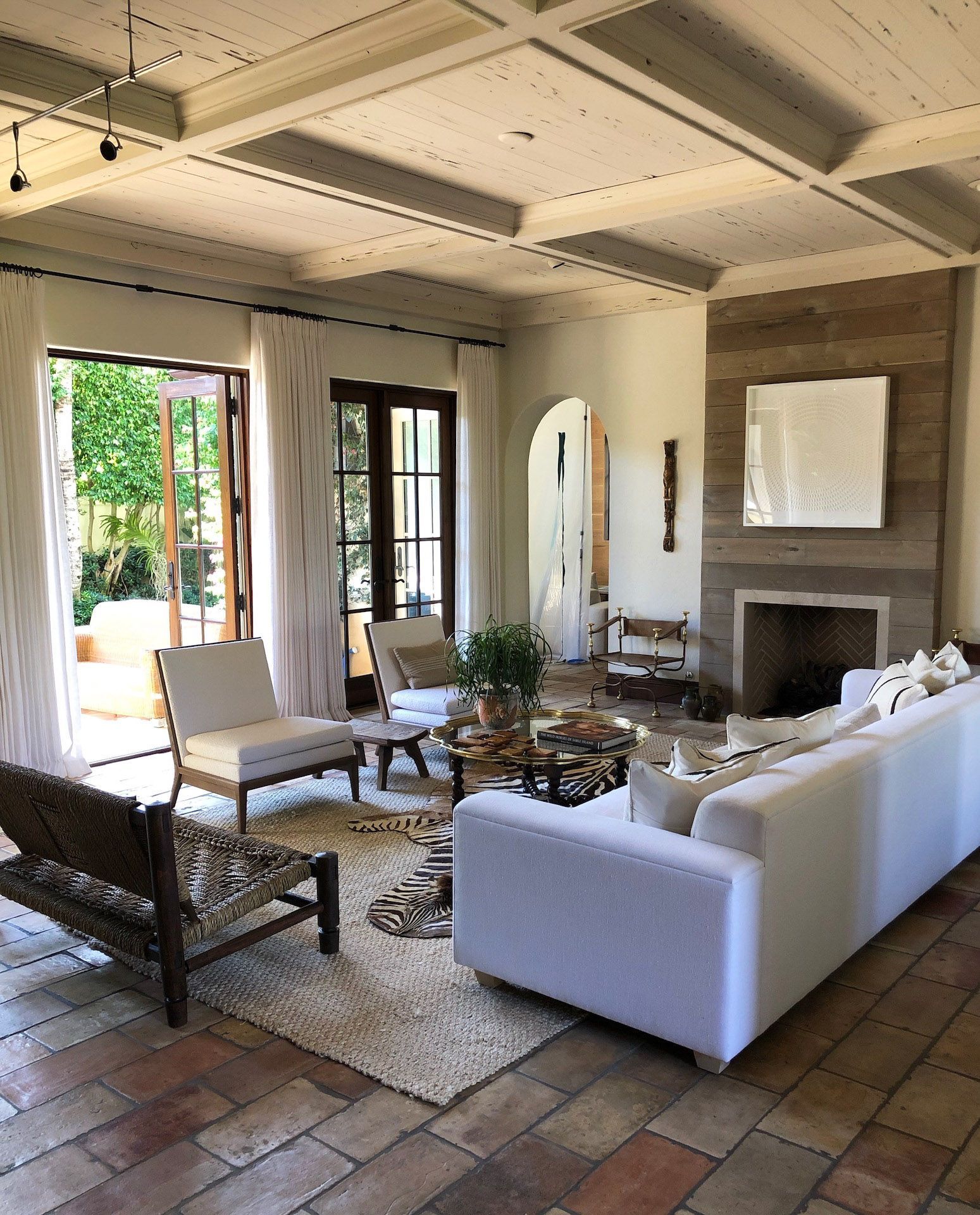 A living room filled with furniture and a fireplace.