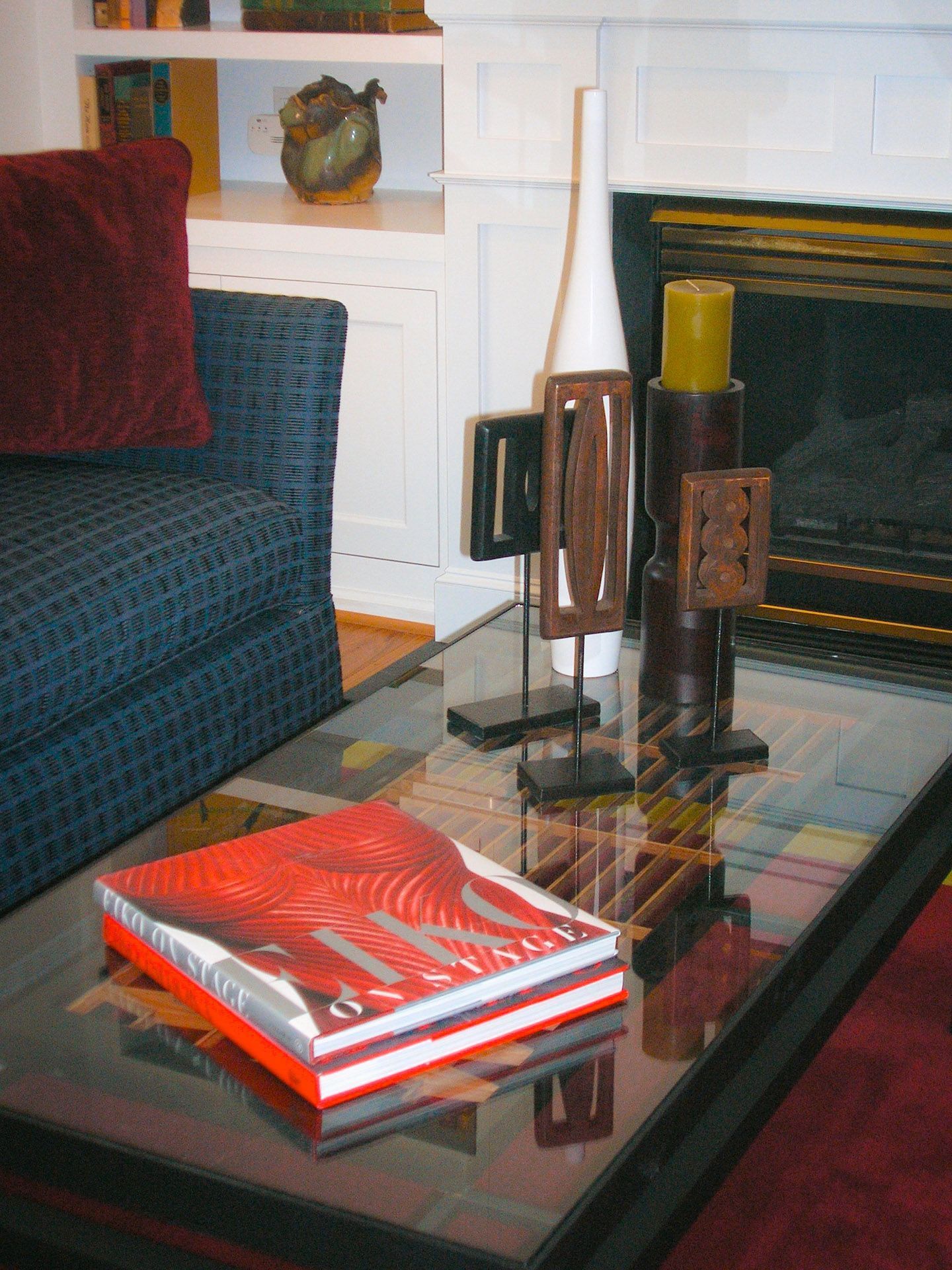 A living room with a couch and a book on a table