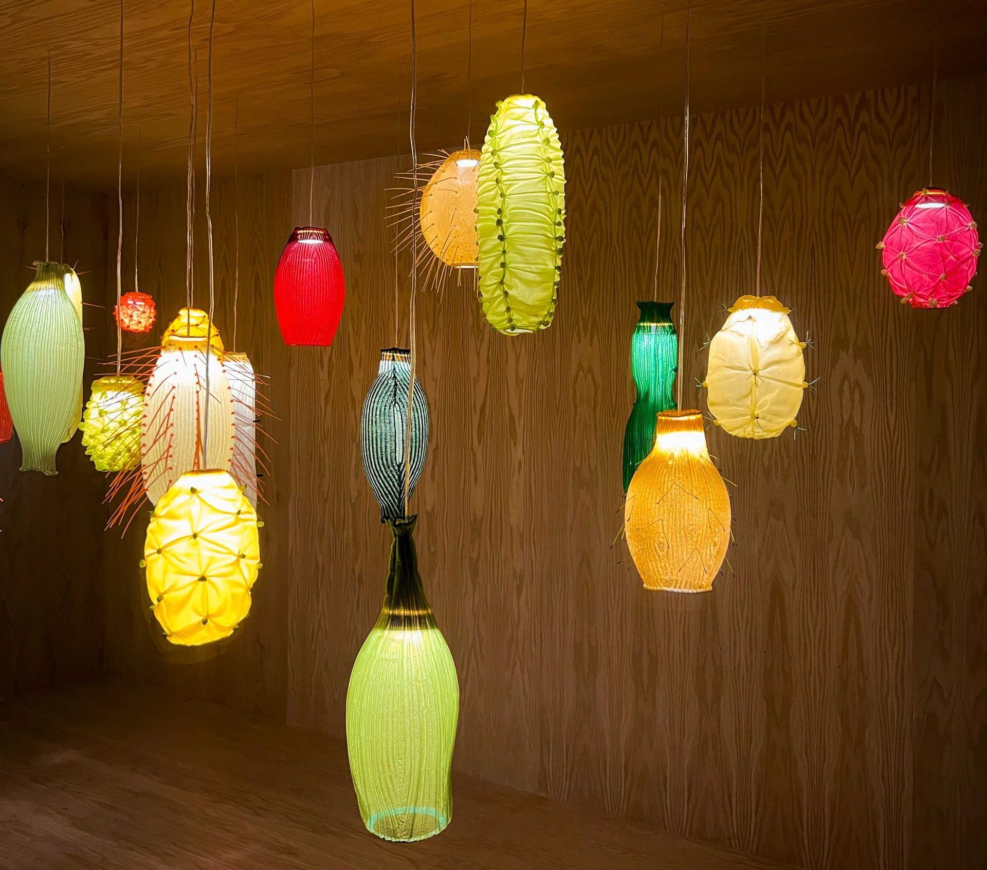 A bunch of colorful lights hanging from the ceiling in Mexico City