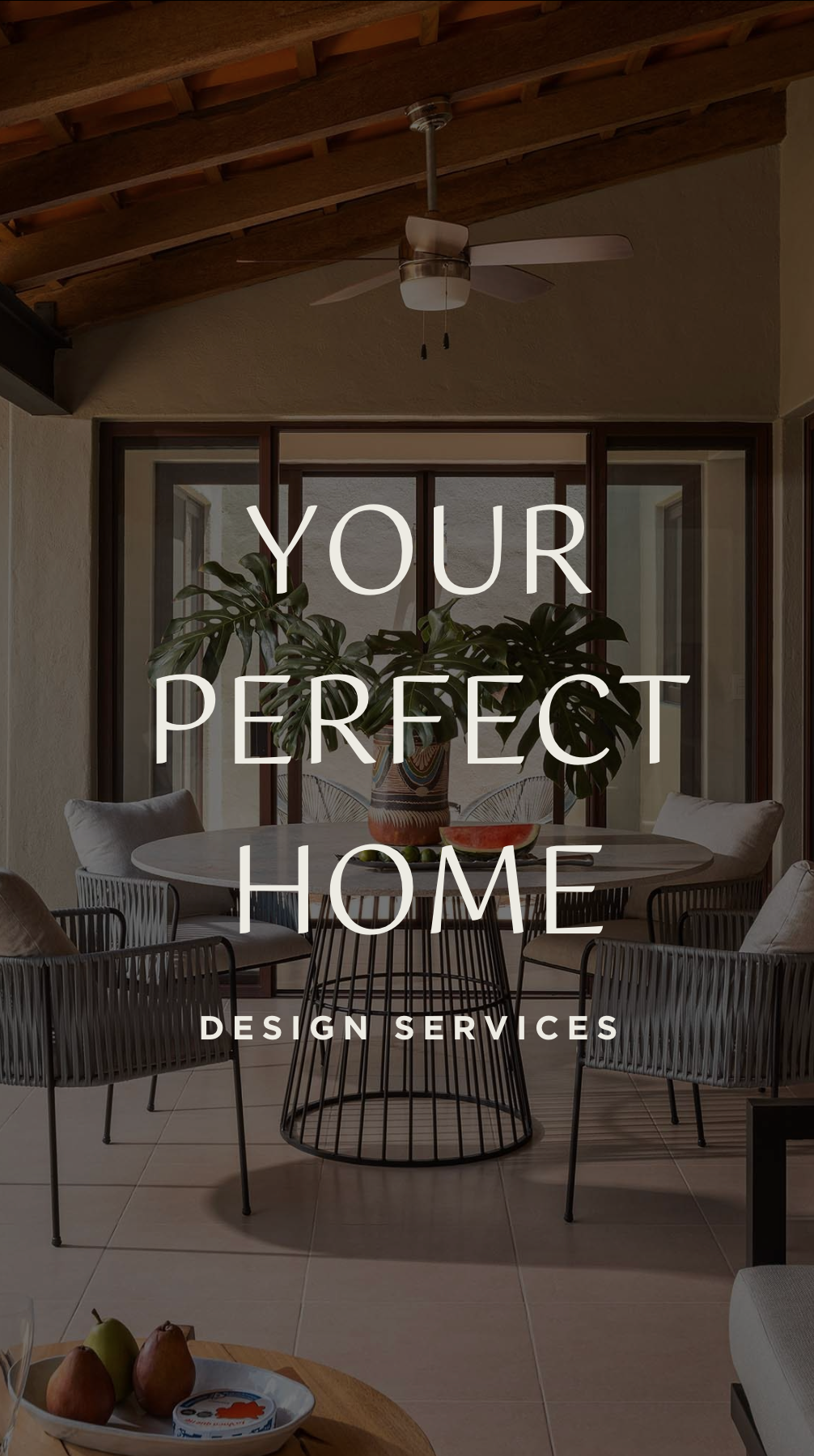 A living room with a ceiling fan and a sign that says `` your perfect home design services ''.