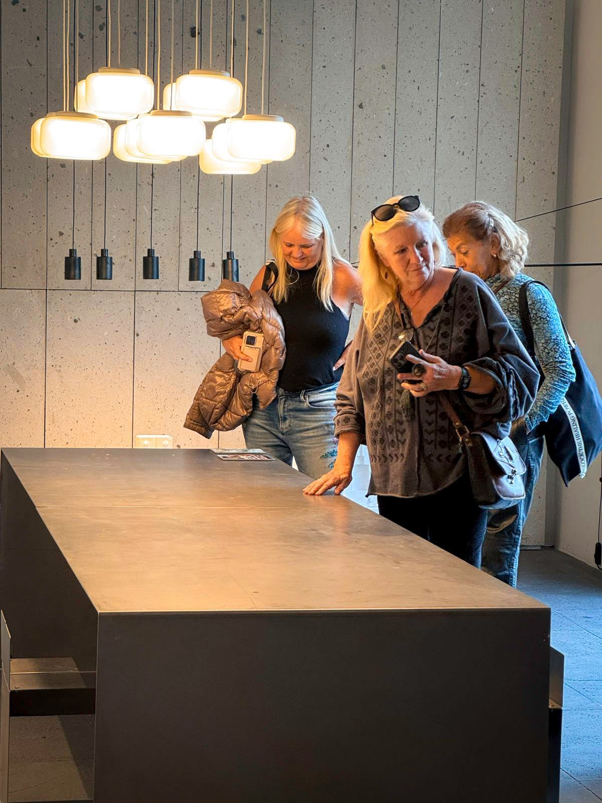 A pink building with a tree in front of it