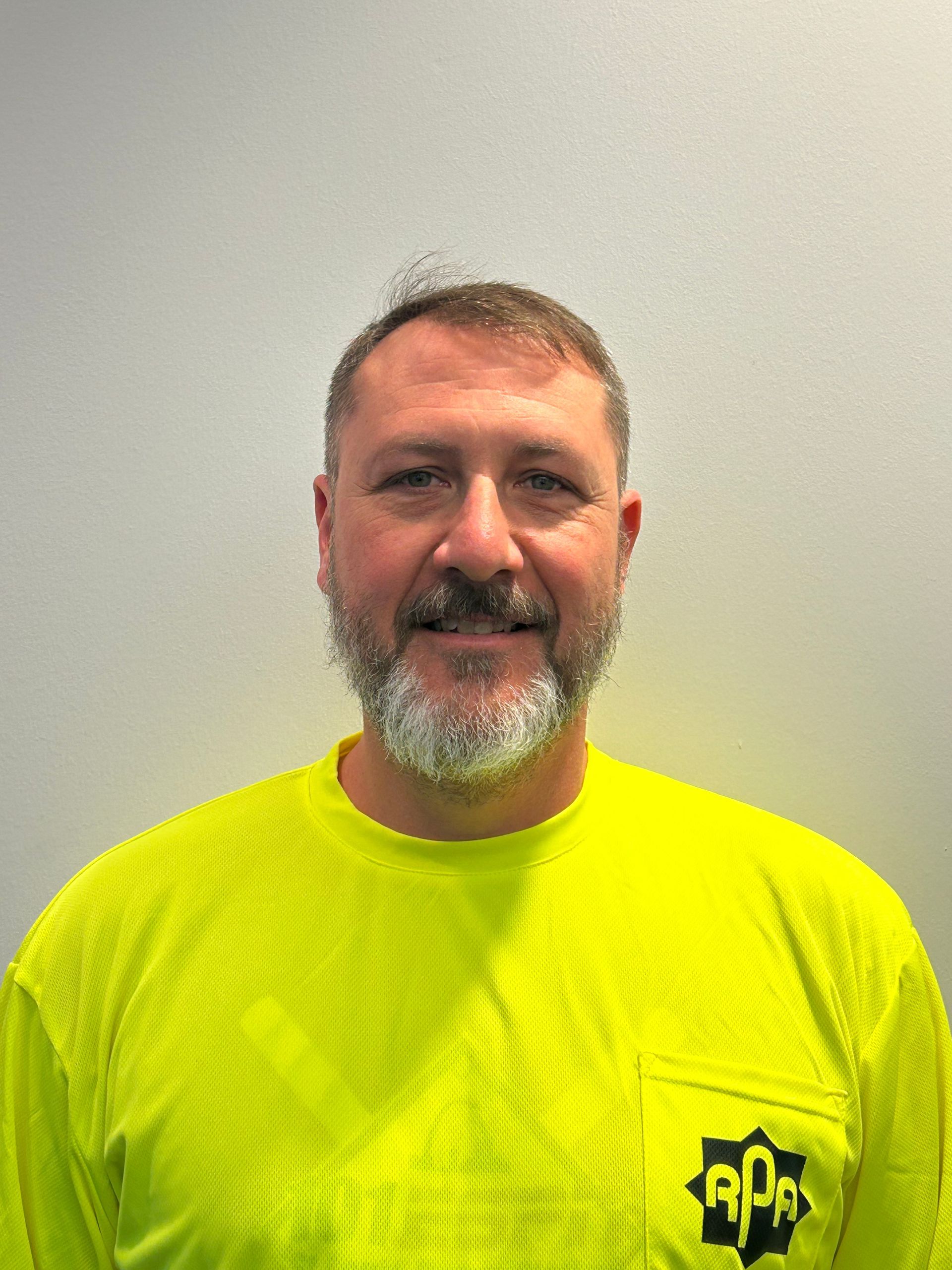 A gray silhouette of a person without a face on a white background.