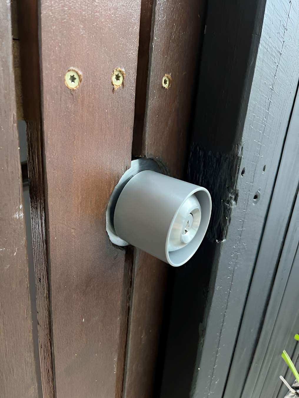 A Close Up Of A Door Knob On A Wooden Door — Grace Locksmiths In Manoora, QLD