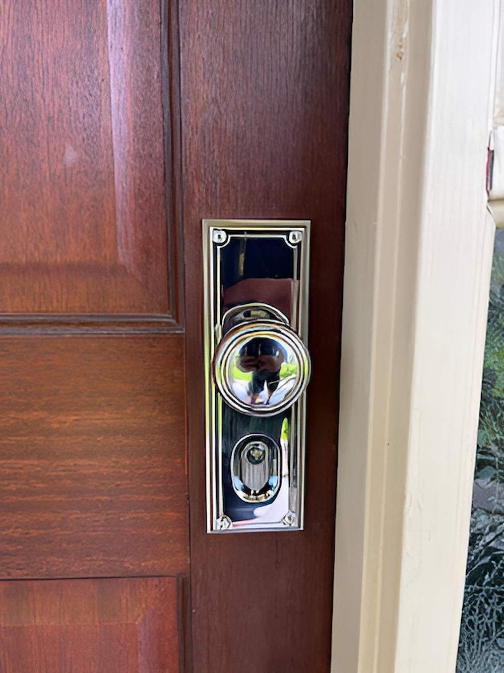 A Close Up Of A Door Knob On A Wooden Door — Grace Locksmiths In Manoora, QLD